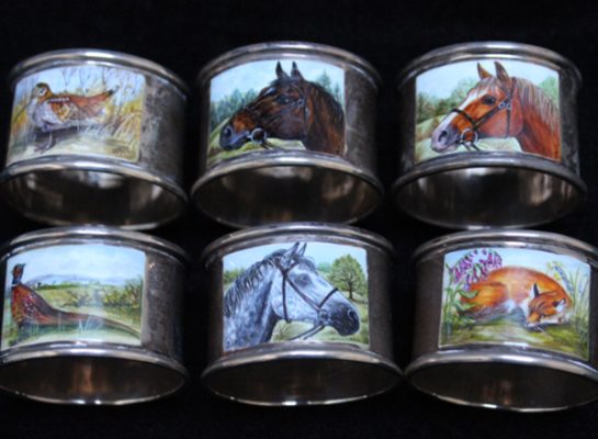 Six animal-themed decorative napkin rings.