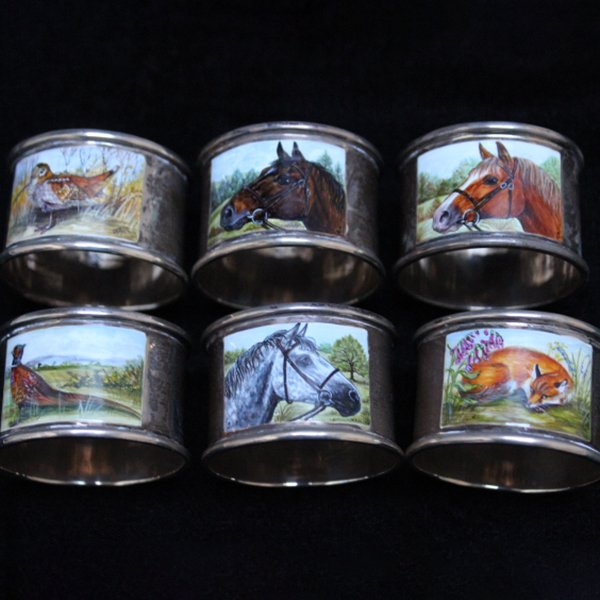 Six animal-themed decorative napkin rings.